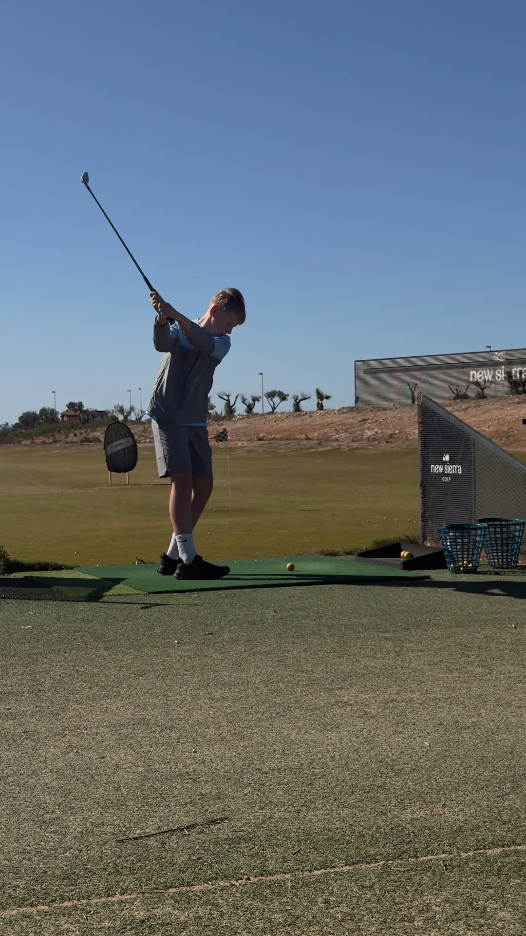 Junior golfer at the New Sierra driving range